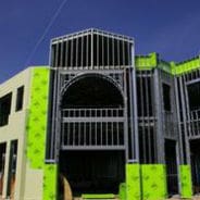 A building with green walls and black trim.